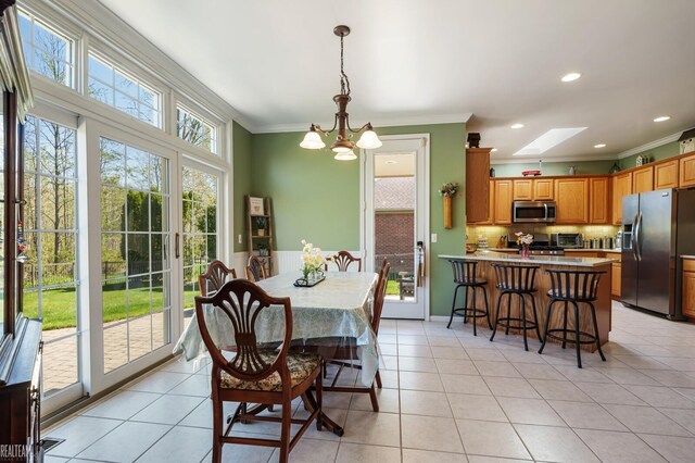 14329 Barton Dr, Washington Twp, MI 48094 - dining area featuring ornamental molding, a chandelier, light tile patterned floors, a skylight, and recessed lighting
