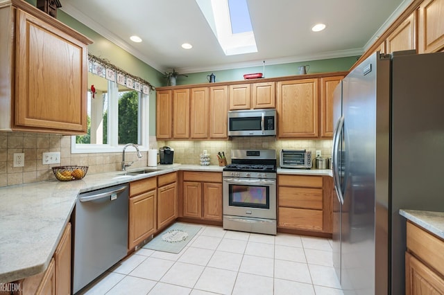 14329 Barton Dr, Washington Twp, MI 48094 - kitchen with appliances with stainless steel finishes, a skylight, crown molding, decorative backsplash, and light tile patterned floors