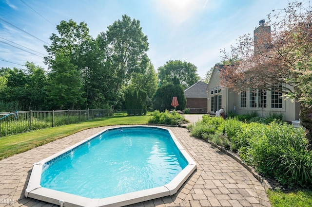 14329 Barton Dr, Washington Twp, MI 48094 - view of swimming pool featuring a fenced backyard and a patio area