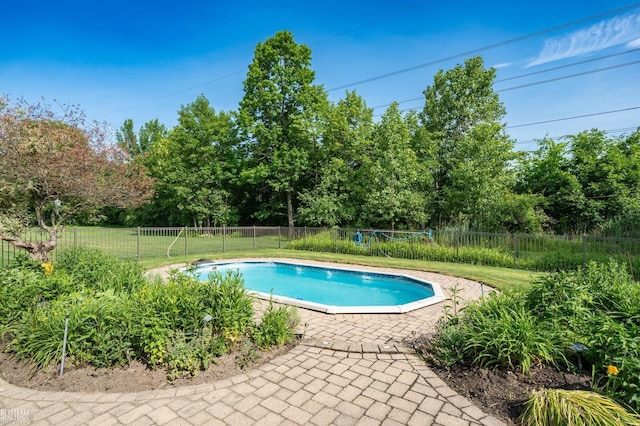 14329 Barton Dr, Washington Twp, MI 48094 - view of pool with a fenced backyard, view of scattered trees, and a patio