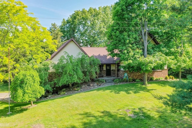6499 Tubspring Rd, Almont, MI 48003 - view of property hidden behind natural elements with a porch and a front yard
