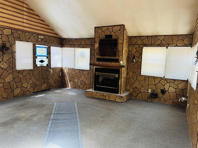 4110 Oak Ridge Dr, Harrison, MI 48625 - unfurnished living room featuring carpet floors, lofted ceiling, and a stone fireplace