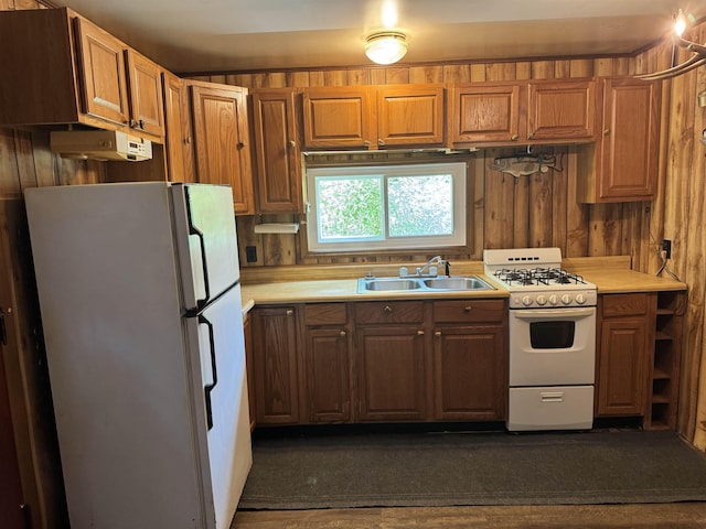 4110 Oak Ridge Dr, Harrison, MI 48625 - kitchen featuring white appliances, light countertops, and brown cabinetry