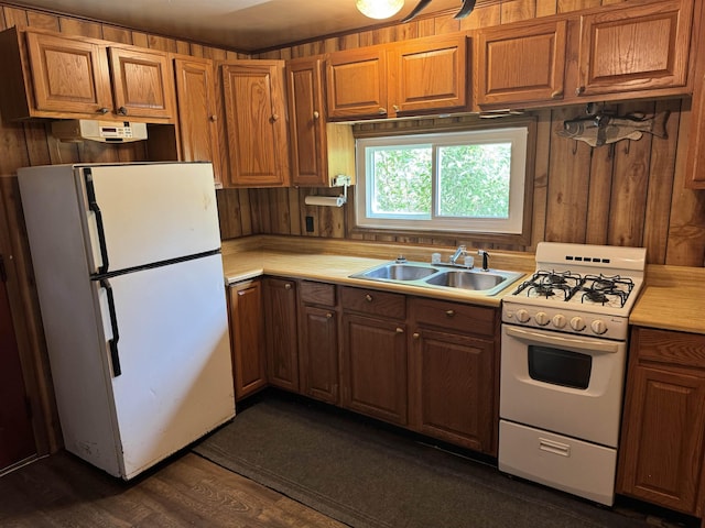 4110 Oak Ridge Dr, Harrison, MI 48625 - kitchen featuring white appliances, light countertops, dark wood-style flooring, and brown cabinetry