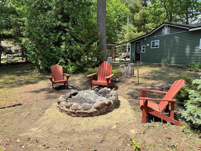4110 Oak Ridge Dr, Harrison, MI 48625 - view of yard featuring an outdoor fire pit