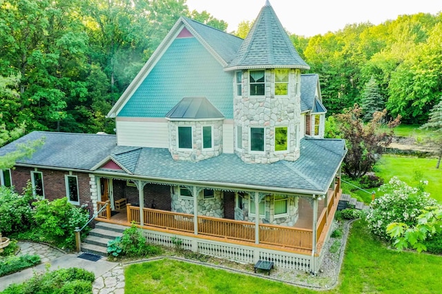 61801 Cetnor Ct, Washington, MI 48094 - victorian house featuring stone siding, a porch, and a front yard