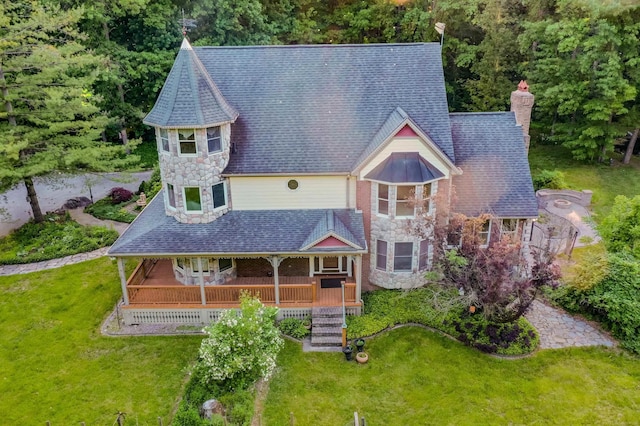 61801 Cetnor Ct, Washington, MI 48094 - view of front of property featuring stone siding, a chimney, a front yard, covered porch, and stairs