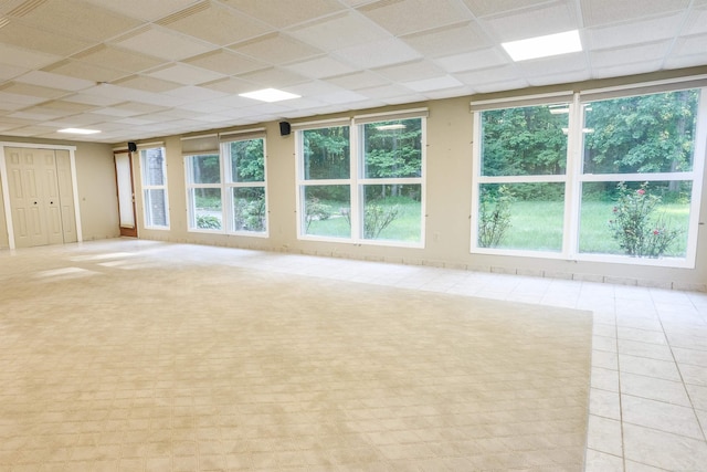 61801 Cetnor Ct, Washington, MI 48094 - unfurnished room with a paneled ceiling and light tile patterned floors