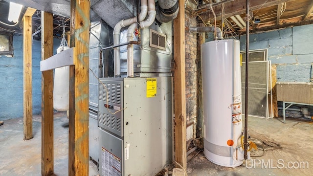 605 S 9th St, Escanaba, MI 49829 - utility room with gas water heater and heating unit