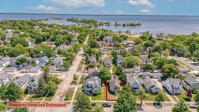 605 S 9th St, Escanaba, MI 49829 - aerial view of residential area with a nearby body of water and property boundaries highlighted