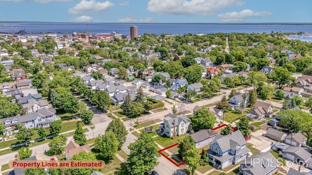 605 S 9th St, Escanaba, MI 49829 - aerial perspective of suburban area with a large body of water