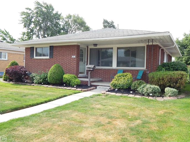 8508 Darlene St, Warren, MI 48093 - view of front of property featuring brick siding and a front lawn