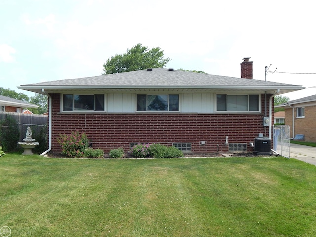 8508 Darlene St, Warren, MI 48093 - bungalow-style home with a chimney, brick siding, and roof with shingles