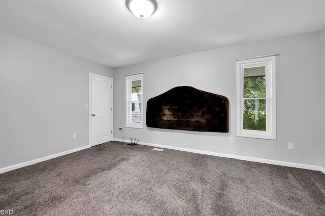 77280 Coon Creek Rd, Armada, MI 48005 - spare room with healthy amount of natural light and dark colored carpet