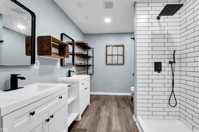 77280 Coon Creek Rd, Armada, MI 48005 - full bathroom with a shower stall, two vanities, wood finished floors, and recessed lighting