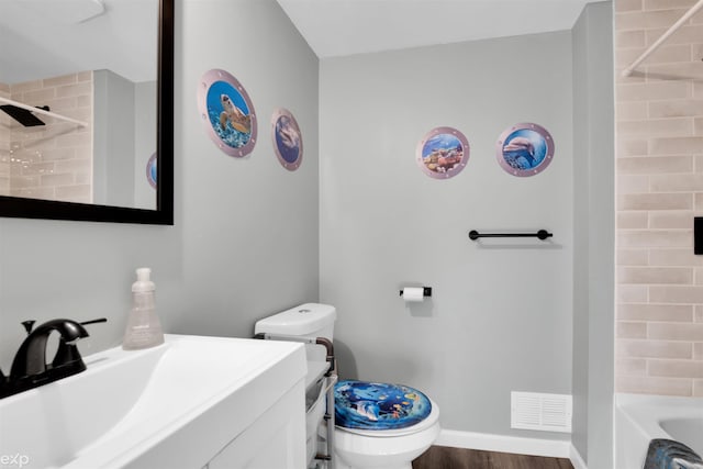 77280 Coon Creek Rd, Armada, MI 48005 - bathroom with vanity, washtub / shower combination, and wood finished floors