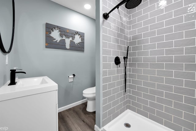 77280 Coon Creek Rd, Armada, MI 48005 - full bathroom with a tile shower, vanity, and wood finished floors