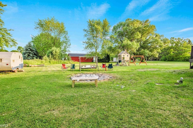 77280 Coon Creek Rd, Armada, MI 48005 - view of green lawn featuring a playground
