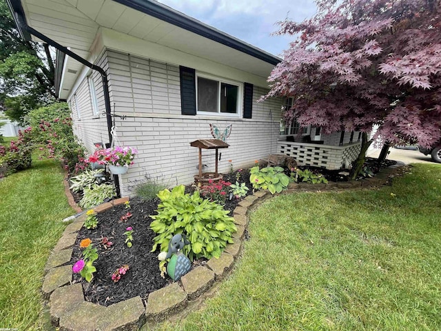 11485 Racine St, Warren, MI 48093 - view of side of home with a lawn and brick siding