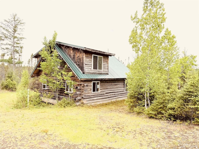 8ACRES Cable Lake Rd, Crystal Falls, MI 49920 - rear view of house featuring log exterior and a metal roof