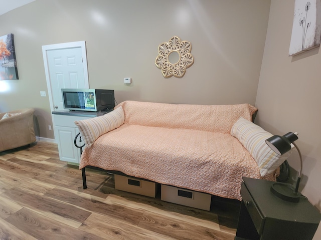 11339 Alpine Dr, Lake, MI 48632 - bedroom with light wood-style floors and baseboards