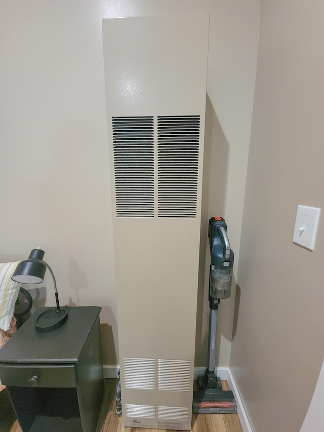 11339 Alpine Dr, Lake, MI 48632 - detailed view of a heating unit and wood finished floors