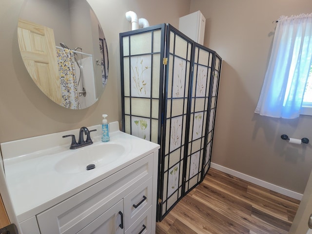 11339 Alpine Dr, Lake, MI 48632 - bathroom with vanity, wood finished floors, and curtained shower
