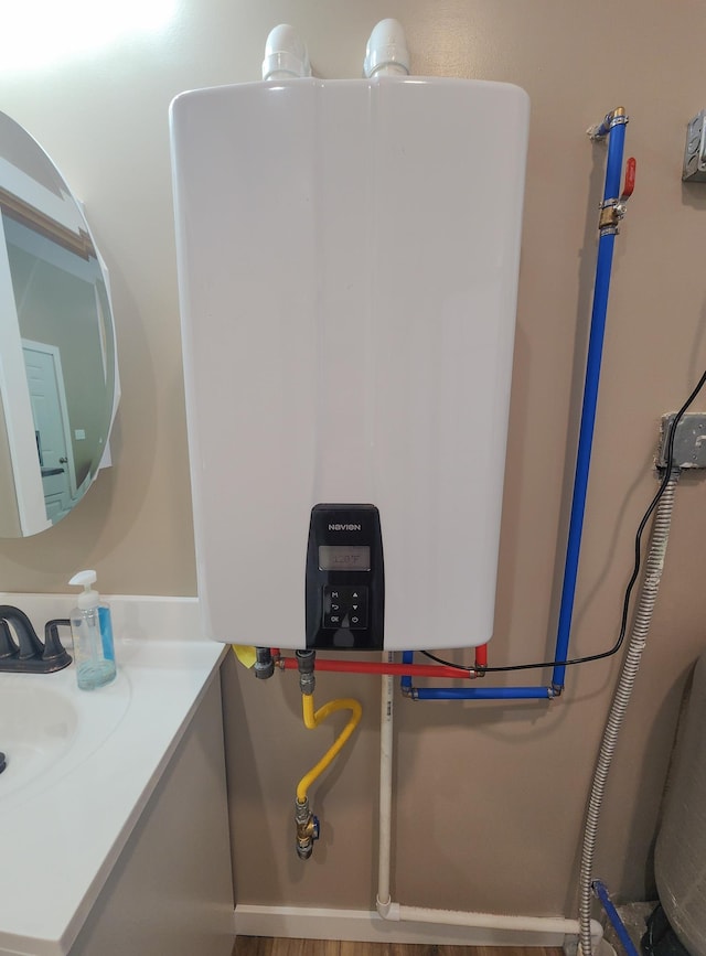 11339 Alpine Dr, Lake, MI 48632 - bathroom with tankless water heater and vanity