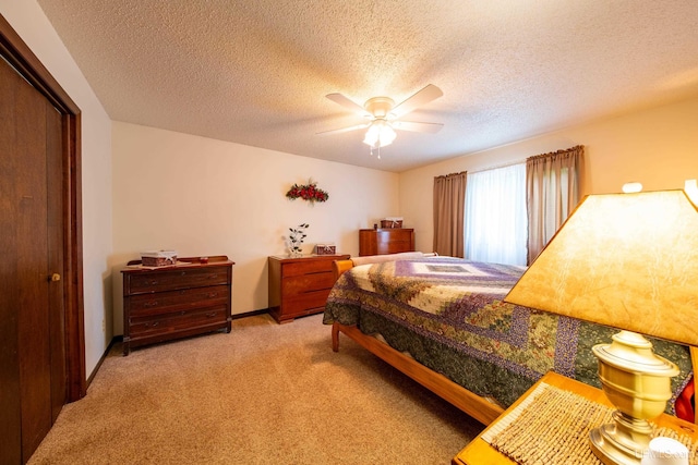 326 County Road Mp Rd, Negaunee, MI 49866 - carpeted bedroom with ceiling fan, a textured ceiling, and a closet