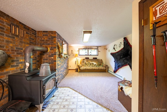 326 County Road Mp Rd, Negaunee, MI 49866 - bedroom featuring a wood stove, a baseboard heating unit, a textured ceiling, and carpet flooring
