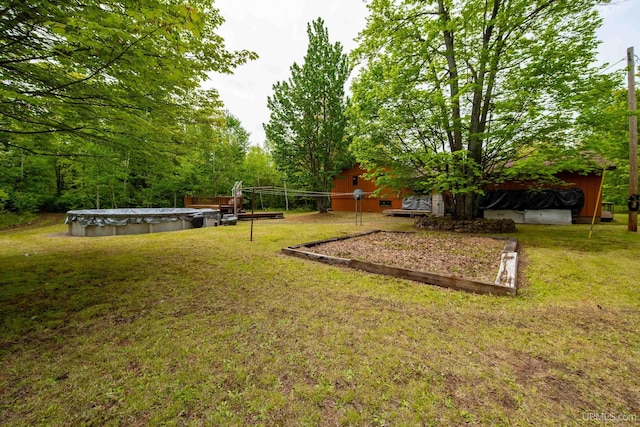 326 County Road Mp Rd, Negaunee, MI 49866 - view of grassy yard featuring a covered pool