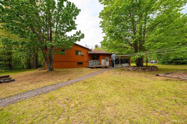 326 County Road Mp Rd, Negaunee, MI 49866 - view of green lawn featuring a wooden deck