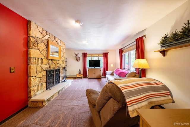 326 County Road Mp Rd, Negaunee, MI 49866 - carpeted living area featuring a stone fireplace and baseboards