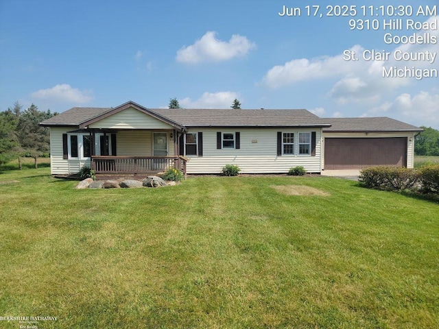 9310 Hill Rd, Wales, MI 48027 - ranch-style house featuring a front yard, an attached garage, and a porch