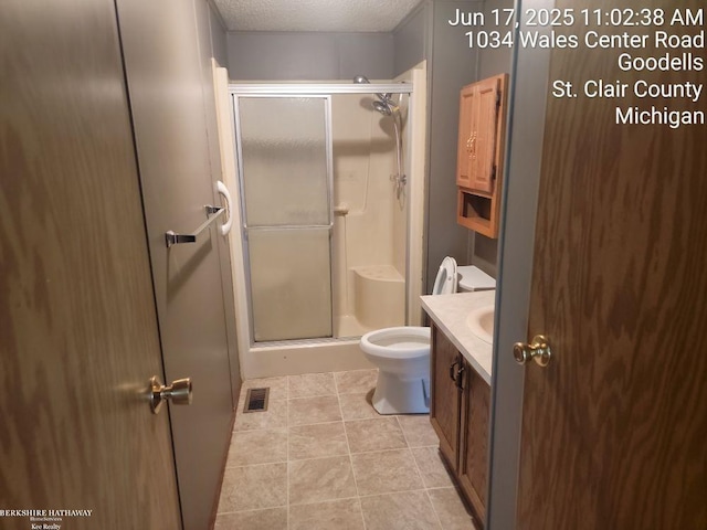 9310 Hill Rd, Wales, MI 48027 - bathroom with vanity, a shower stall, tile patterned floors, and a textured ceiling
