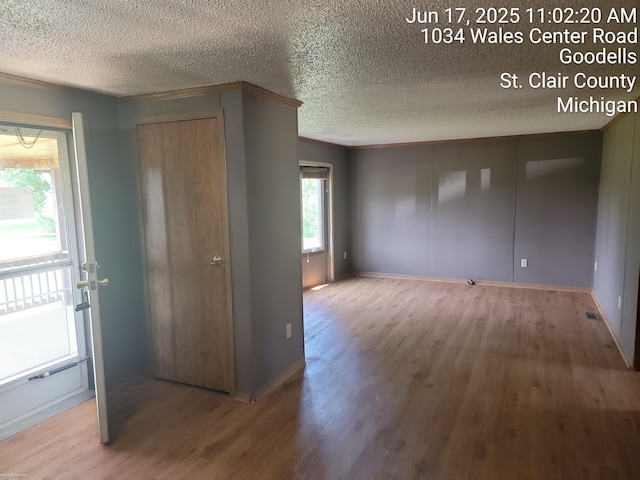 9310 Hill Rd, Wales, MI 48027 - entryway with wood finished floors and a textured ceiling