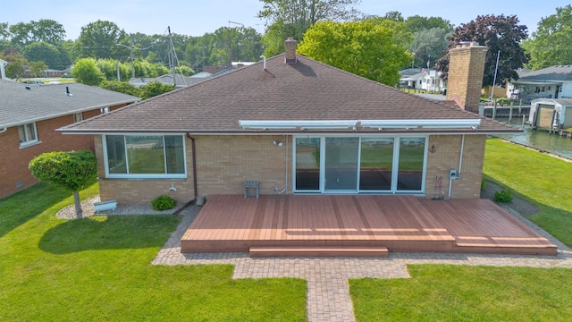 104 Marell St, East China, MI 48054 - rear view of property with a chimney, brick siding, roof with shingles, and a wooden deck