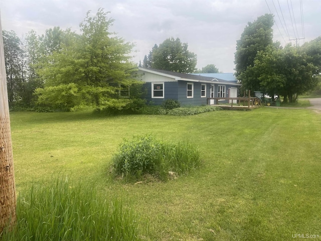 26121 S Calumet St, Laurium, MI 49913 - view of grassy yard featuring a wooden deck