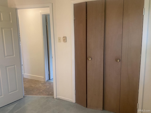26121 S Calumet St, Laurium, MI 49913 - unfurnished bedroom featuring a closet and carpet flooring