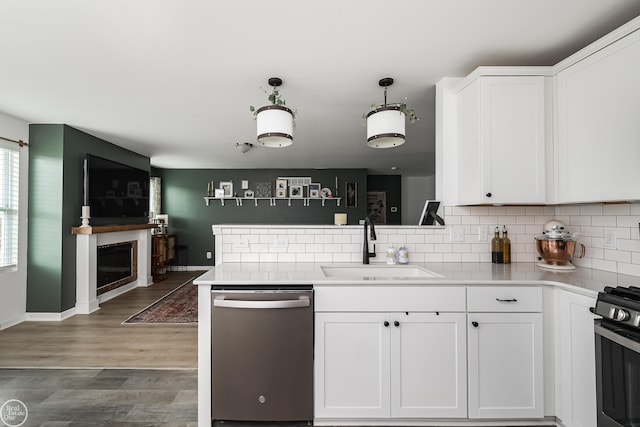 58530 Westmoore Cir, New Haven, MI 48048 - kitchen with stainless steel appliances, tasteful backsplash, and white cabinetry
