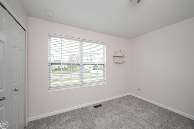 58530 Westmoore Cir, New Haven, MI 48048 - unfurnished room with plenty of natural light, carpet, and a smoke detector
