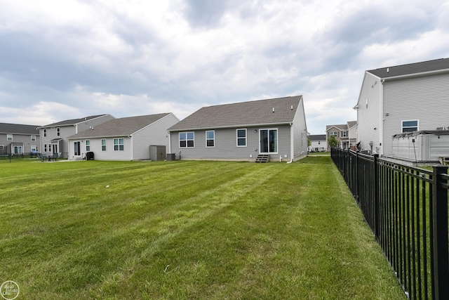 58530 Westmoore Cir, New Haven, MI 48048 - back of house with a residential view, entry steps, and a shingled roof