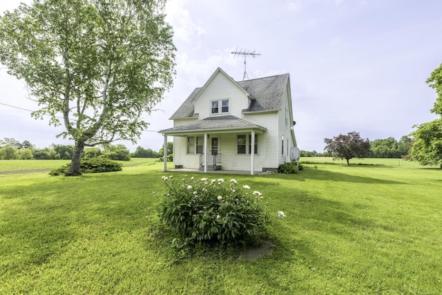 6410 Sheridan Line Rd, Croswell, MI 48422 - back of property with a porch, roof with shingles, and a lawn