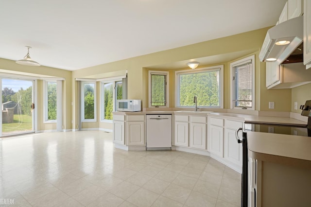 14060 Wayford Run, Shelby Twp, MI 48315 - kitchen featuring white appliances, range hood, light countertops, and white cabinets
