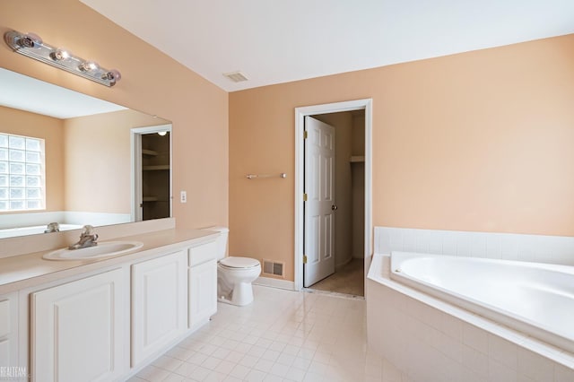 14060 Wayford Run, Shelby Twp, MI 48315 - bathroom with a garden tub, vanity, a closet, and tile patterned floors
