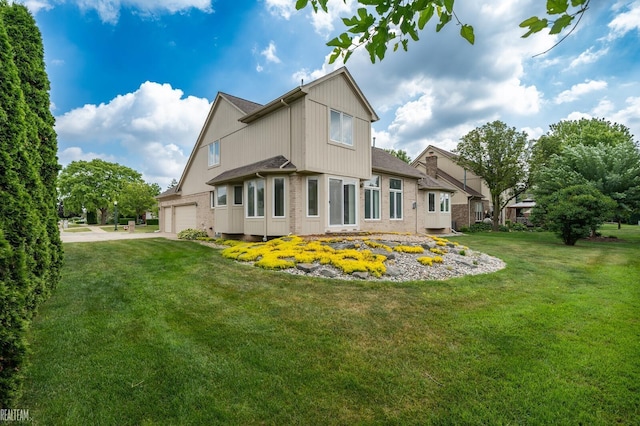 14060 Wayford Run, Shelby Twp, MI 48315 - back of house with a yard and a garage
