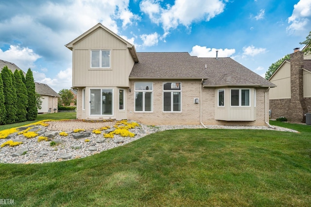 14060 Wayford Run, Shelby Twp, MI 48315 - back of property featuring brick siding, a lawn, and roof with shingles