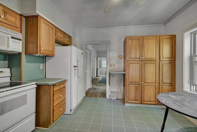 79050 Capac Rd, Armada, MI 48005 - kitchen with white appliances, brown cabinets, crown molding, light countertops, and a ceiling fan