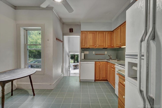 79050 Capac Rd, Armada, MI 48005 - kitchen featuring white appliances, ornamental molding, ceiling fan, light countertops, and brown cabinetry