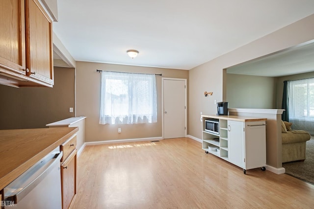 32308 Norwich Ct, Fraser, MI 48026 - kitchen with white dishwasher, light wood-style floors, light countertops, and brown cabinets